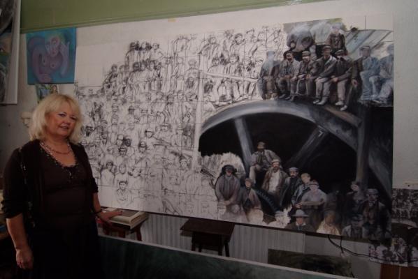 Sarah Maria Rhys with her major piece illustrating a local nineteenth century coal mining group. The completed work has been on show in King Street Gallery, Carmarthen.